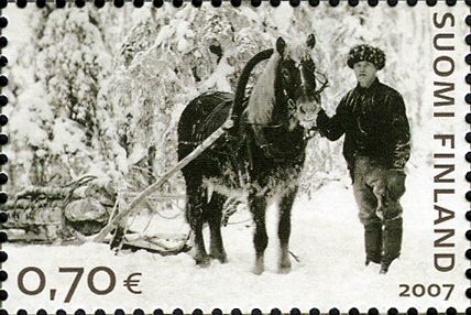 Man and horse hauling wood