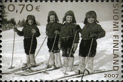 2 Pairs of twin boys skiing