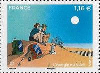 Backpackers on Sand Dune with Solar Panel Backpacks