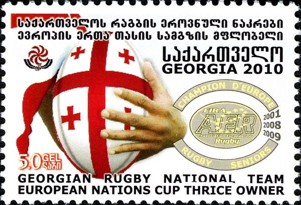 Hand with Rugby Ball and Emblem