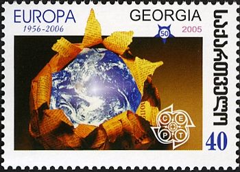Globe Enclosed in Newspapers