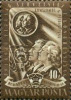 Workers in front of a flag