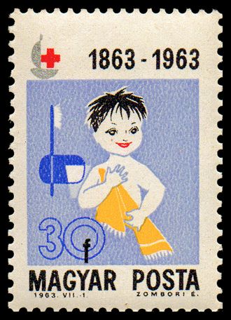 Child with towel and toothbrush