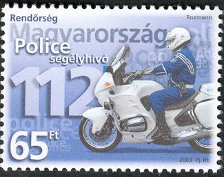 Policeman on motorbike and emergency phone number