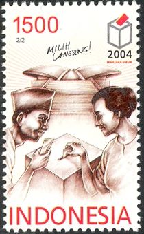 Man and woman casting ballots