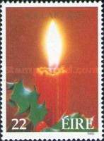 Lighted Candle and Holly