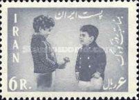 Boy presents some flowers to the Crown Prince Cyrus Reza