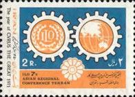 Gears with ILO emblem and continent Asia