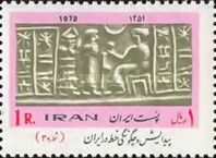 Seated Scribe with Characters on the Right and the Left