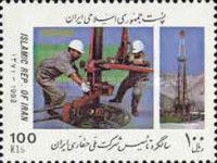 Workers Drilling and Drilling Rig