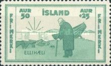 Aged fisherman and rowing boat