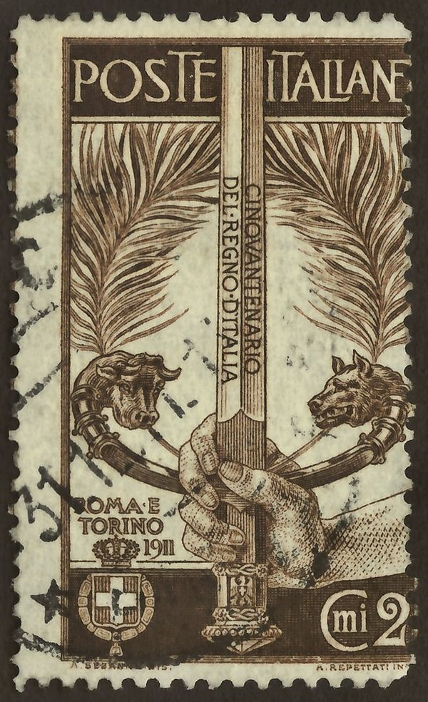 Sword wielded by a hand, the hilt symbolizing Turin and Rome