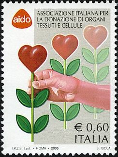 Hand that picks an heart-shaped flower