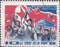 Demonstrators in front of a North Korean flag