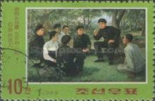 Kim speaking outdoors