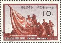 Bronze sculpture of draped flag, soldier, workers