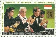 Prince Rainier and his children applauding
