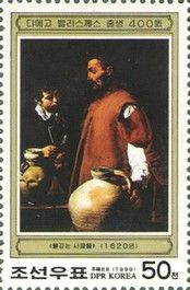 Men drawing water from a well