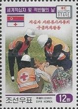 Red Cross medics administering first aid