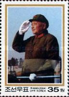 Deng saluting at military review