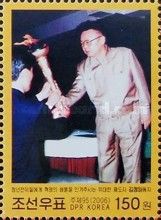 Kim Jong Il with torch