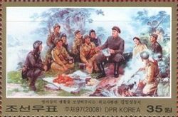 Kim Il Sung at a meal in the field