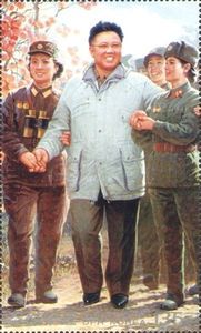 Kim Jong Il, accompanied by soldiers