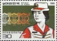 Female soldier and emblem of the Corps