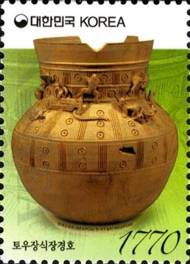 Long-necked Jar with Clay Figurines