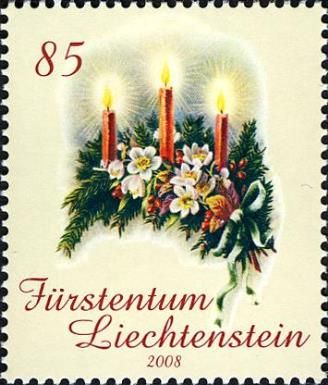 Candles, flowers and evergreen branches