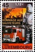 Fire Engine and Fireman wearing Protective Clothing