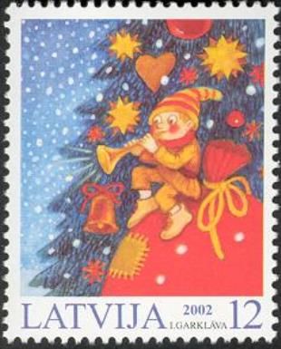 Elf on Sack beside Christmas Tree