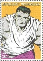 Hulk with gray skin, wearing white shirt