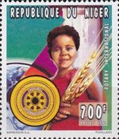 Girl holding sheaves of grain
