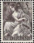 Woman with horn of plenty in front of ruins