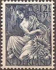 Woman with horn of plenty in front of ruins