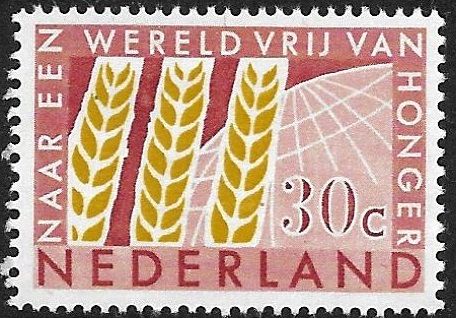 Three Ears of Corn in front of Globe