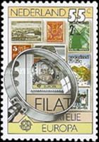 Stamps and magnifying Glass