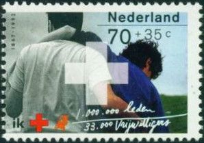 Medic giving aid to a wounded man