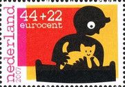 Boy playing with cat