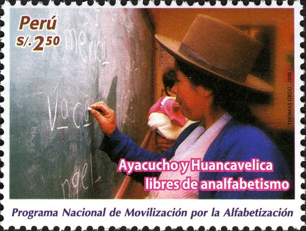 Woman writing on blackboard
