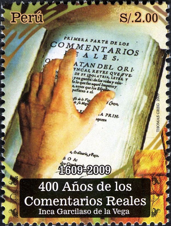 Hand on open book