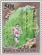 Competitor running through Loniu Caves