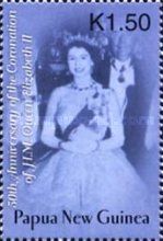 Queen wearing white evening dress, sash and tiara