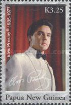 Elvis in white tuxedo with black tie