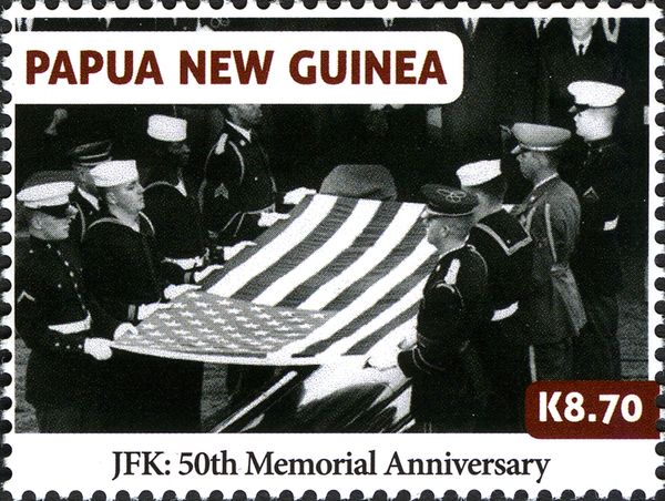 US servicemen carrying US flag