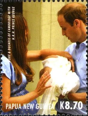 Catherine handing Prince George to William