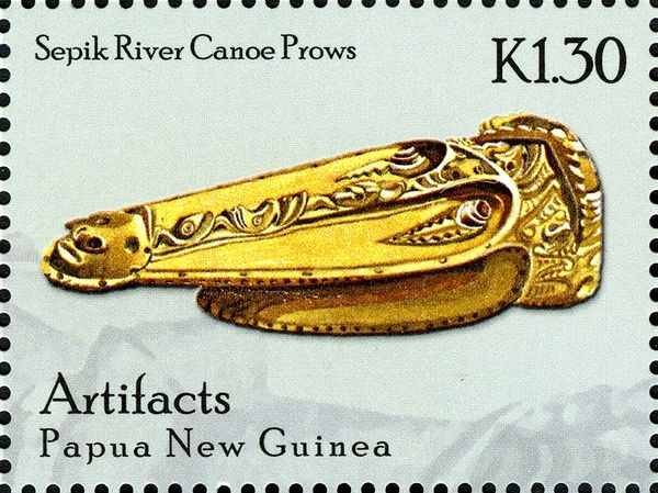 Sepik River canoe prow with man's face carved at tip