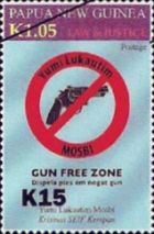 Gun free zone emblem ('Krismas SEIF Kempan') - surcharged