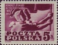 Two workers holding a flag